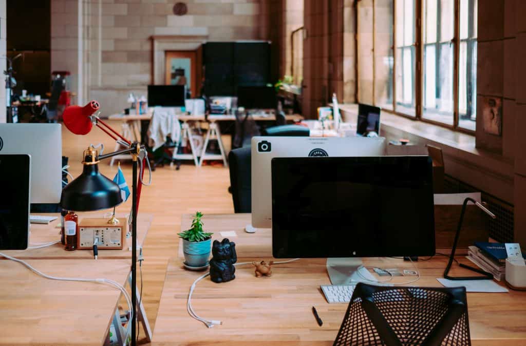 Open Office scene with lots of monitors and fun desk toys. 