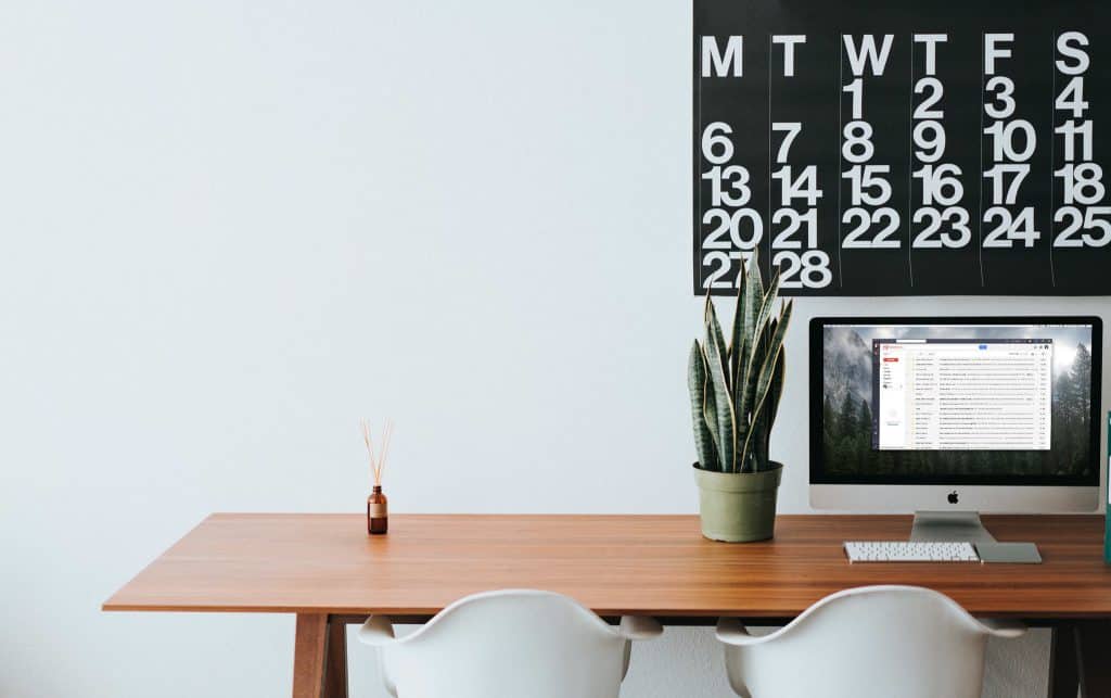 A desk and a computer screen with the Shift app open. 